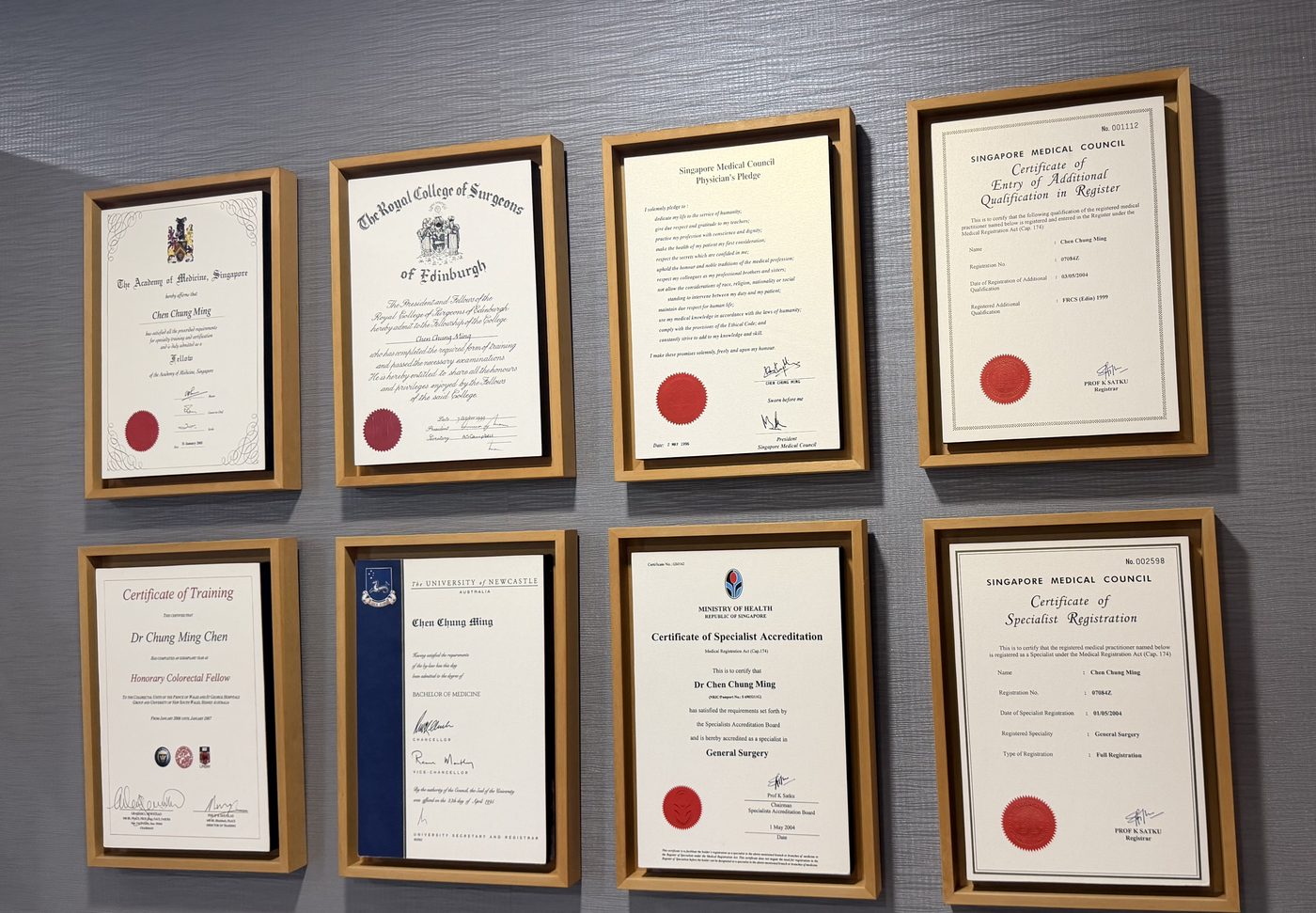 Framed fellowship and specialist registration certificates displayed at Affinity Surgery.
